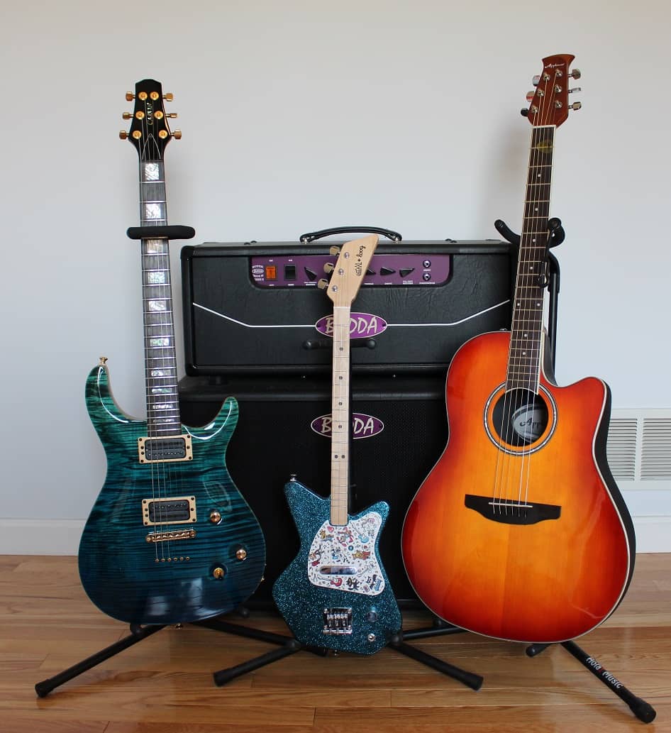 Loog guitar side by side with professional guitar rig