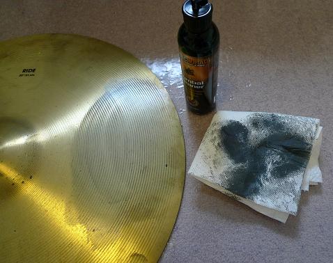 Cymbal being cleaned