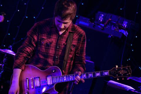 Max Helyer playing guitar