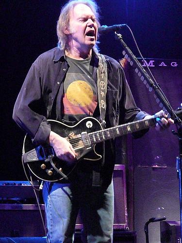 Neil Young playing guitar