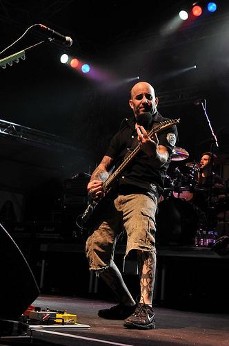 Scott Ian playing guitar with Anthrax