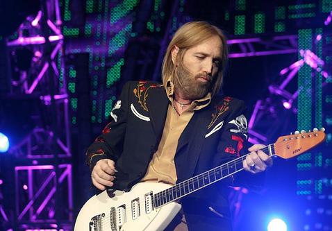 Tom Petty playing guitar live