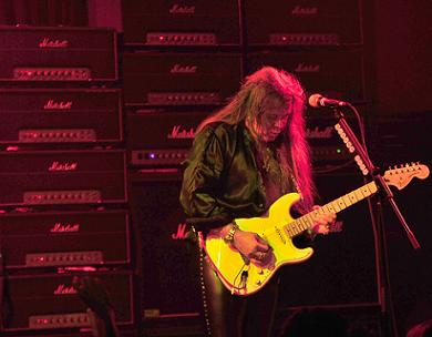 Yngwie playing Fender strat guitar live on stage