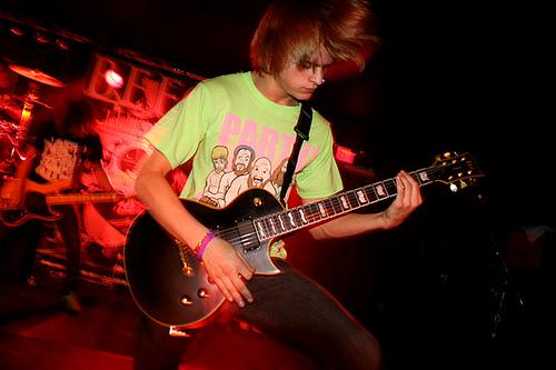 Elliott playing guitar with Before Their Eyes