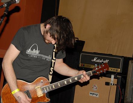 Andrew Elstner playing guitar