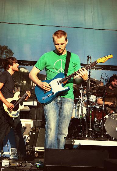 Brendan Ekstrom playing guitar at concert