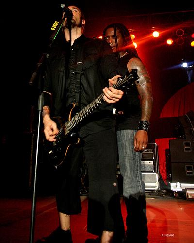 Clint playing guitar with Sevendust