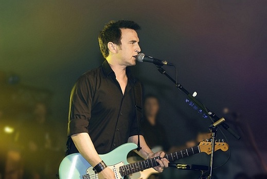 Colin James playing guitar