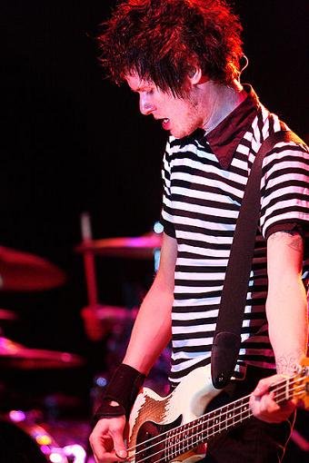 Cone McCaslin playing bass guitar with Sum 41