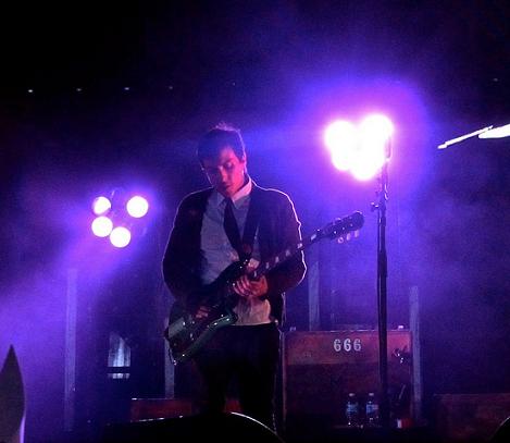 Frank Iero playing guitar at concert
