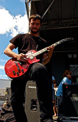 Garrett playing guitar live on stage