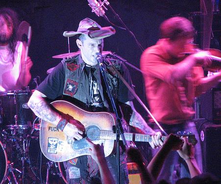 Hank Williams III playing guitar on stage