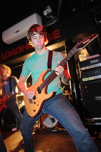 JB playing guitar with August Burns Red