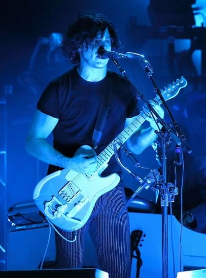 Jack White playing guitar at concert