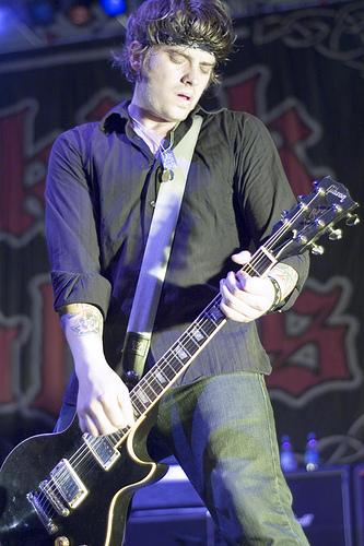 James playing guitar at a concert