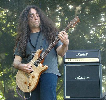 Jim Matheos playing guitar on stage