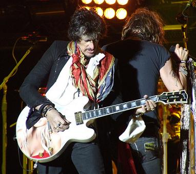 Joe Perry playing guitar with Aerosmith