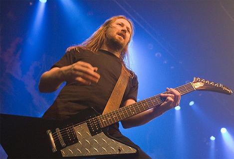 Johan playing guitar at a concert