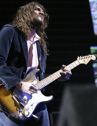 John on a strat guitar