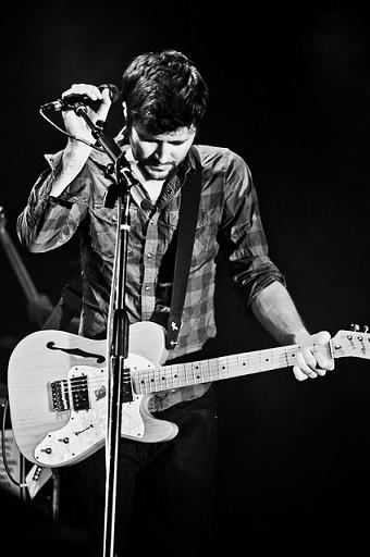 John Nolan playing guitar at concert