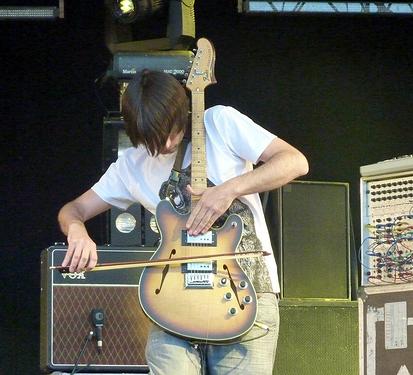 Jonny Greenwood playing guitar