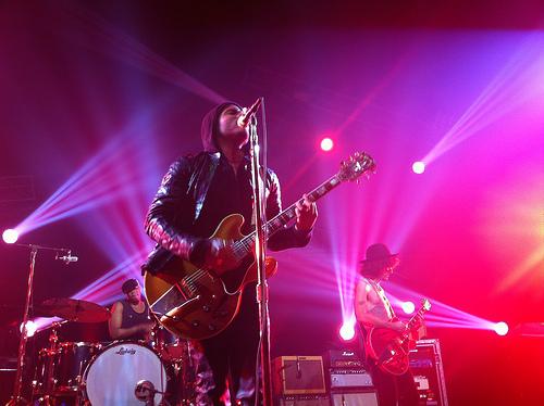 Lenny Kravitz playing guitar at concert