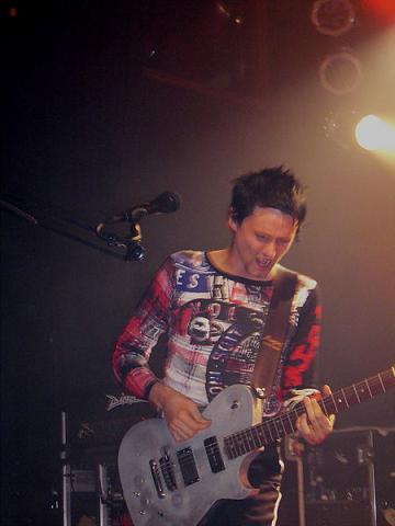 Matt Bellamy playing guitar with Muse