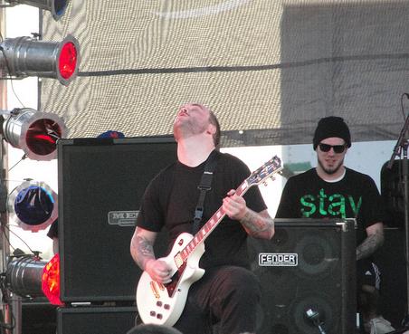 Mike Mulholland playing guitar with Emmure