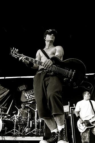 Tim Armstrong playing guitar