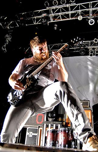 Tim McTague playing guitar at concert