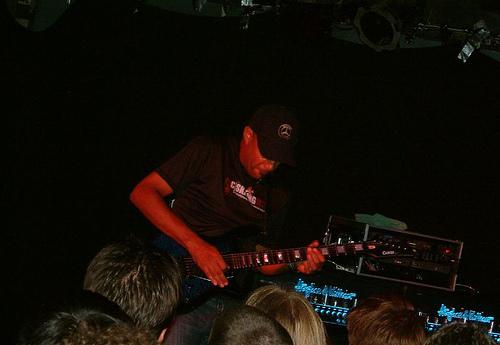 Tony MacAlpine playing guitar